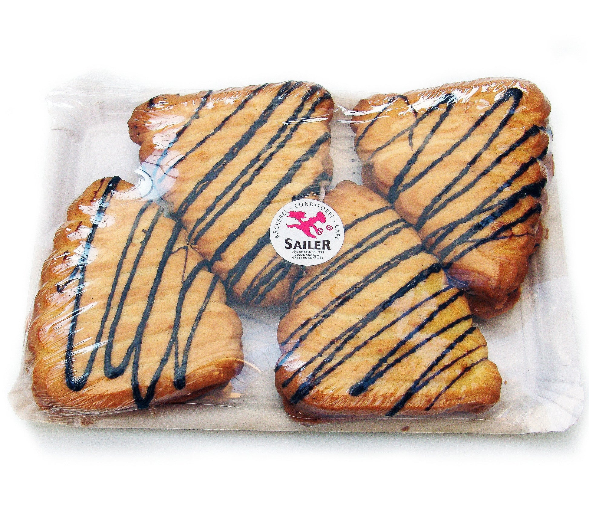 Vierflammende Herzen aus feinen Backwaren, frisch gebacken und goldbraun, perfekt zum Teilen.